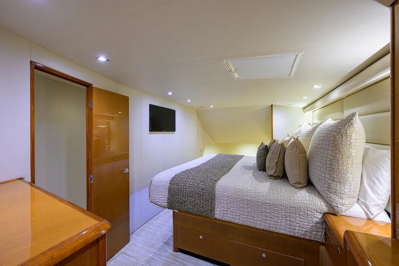 Slide: The Image of Luxurious bedroom interior of 2004 Viking 65 Enclosed Bridge yacht with modern decor. - 28