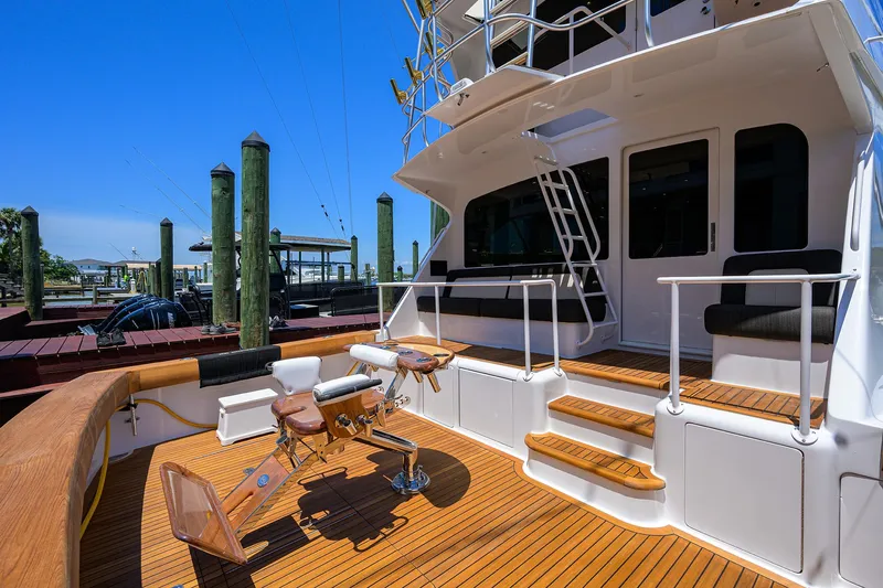 Slide: The Image of 2004 Viking 65 Enclosed Bridge w/Tower yacht deck with seating and fishing chair. - 6