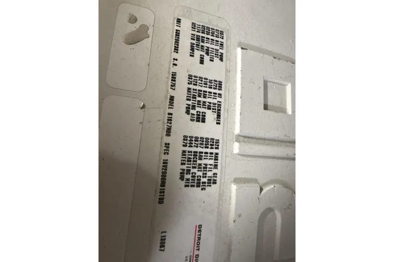 Slide: The Image of 2004 Viking 65 Enclosed Bridge w/Tower engine specifications label. - 87