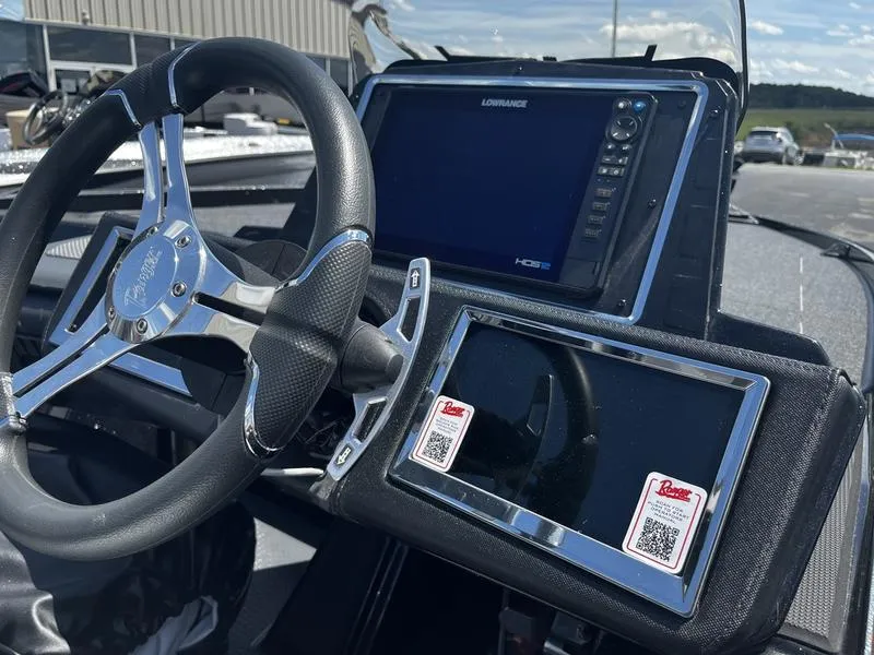 Slide: The Image of 2024 Ranger Z521R Ranger Cup Equipped boat dashboard with steering wheel and electronic displays. - 6