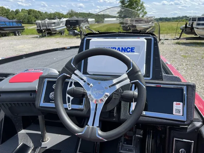 Slide: The Image of 2024 Ranger Z521R Ranger Cup Equipped boat dashboard with steering wheel and digital displays. - 4
