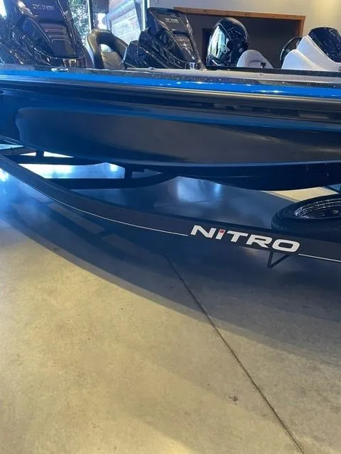 Slide: The Image of 2024 Nitro Z19 boat on display in showroom. - 2