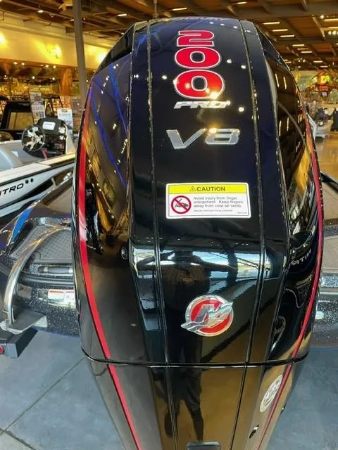 Slide: The Image of 2024 Nitro Z19 boat with a 200 HP V6 engine displayed indoors. - 9