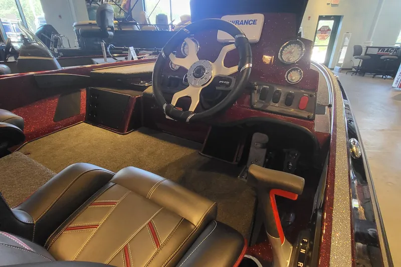 Slide: The Image of 2024 Nitro Z18 boat interior with steering wheel and dashboard controls. - 4