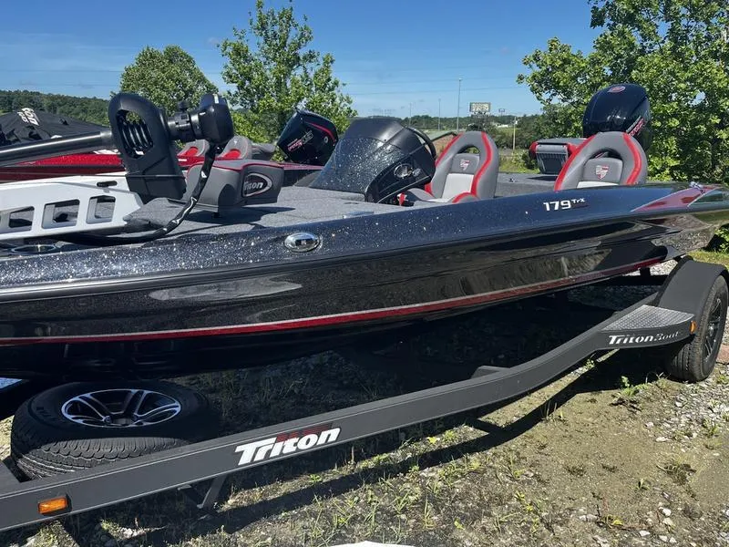 The Image of 2024 Triton 179 TrX bass boat on trailer, side view. - 0