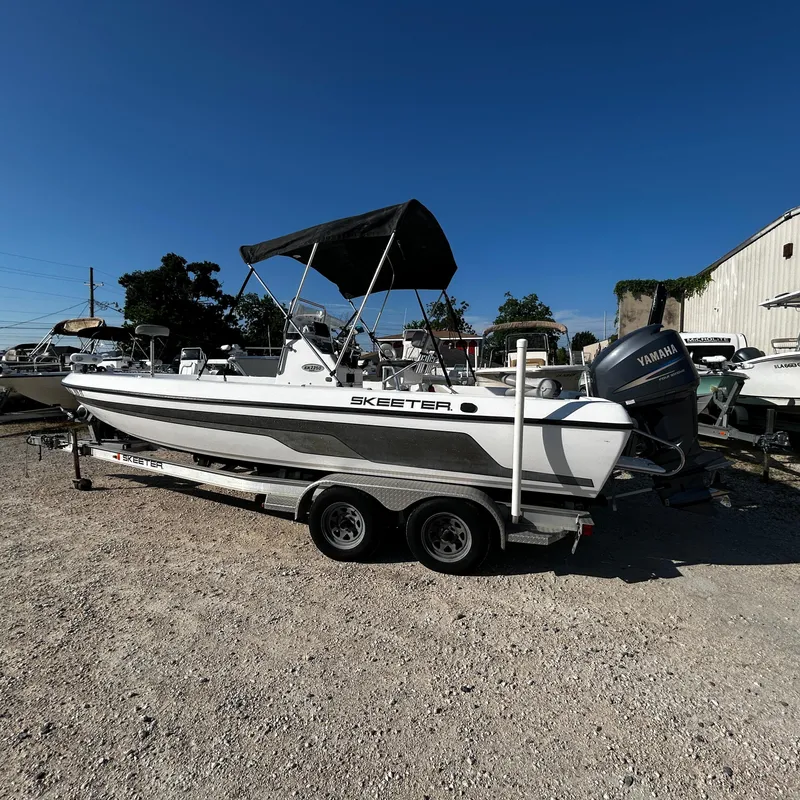 Slide: The Image of 2008 Skeeter ZX2250 boat on a trailer with Yamaha outboard motor. - 1