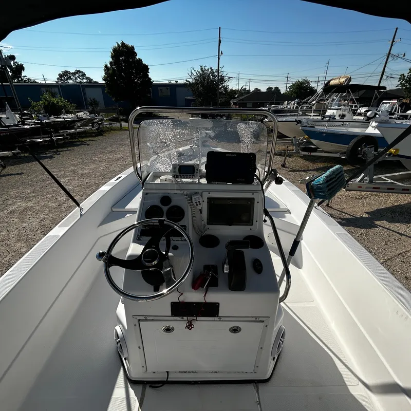 Slide: The Image of 2008 Skeeter ZX2250 boat console with steering wheel and navigation equipment. - 12