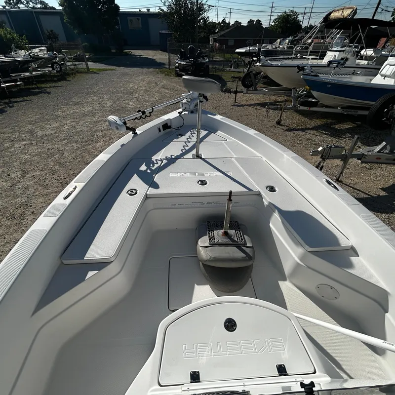 Slide: The Image of 2008 Skeeter ZX2250 boat interior with fishing equipment. - 13