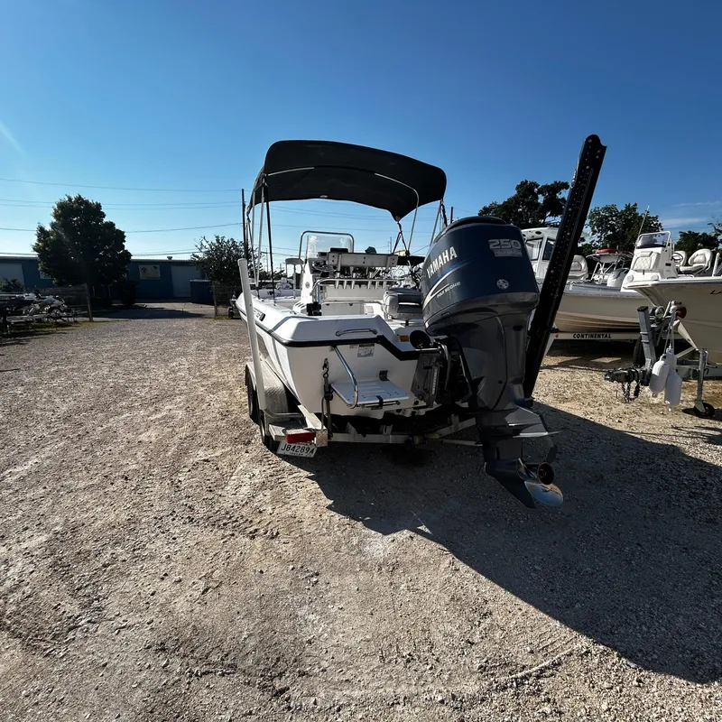 Slide: The Image of 2008 Skeeter ZX2250 boat with Yamaha 250 engine in a boatyard. - 2