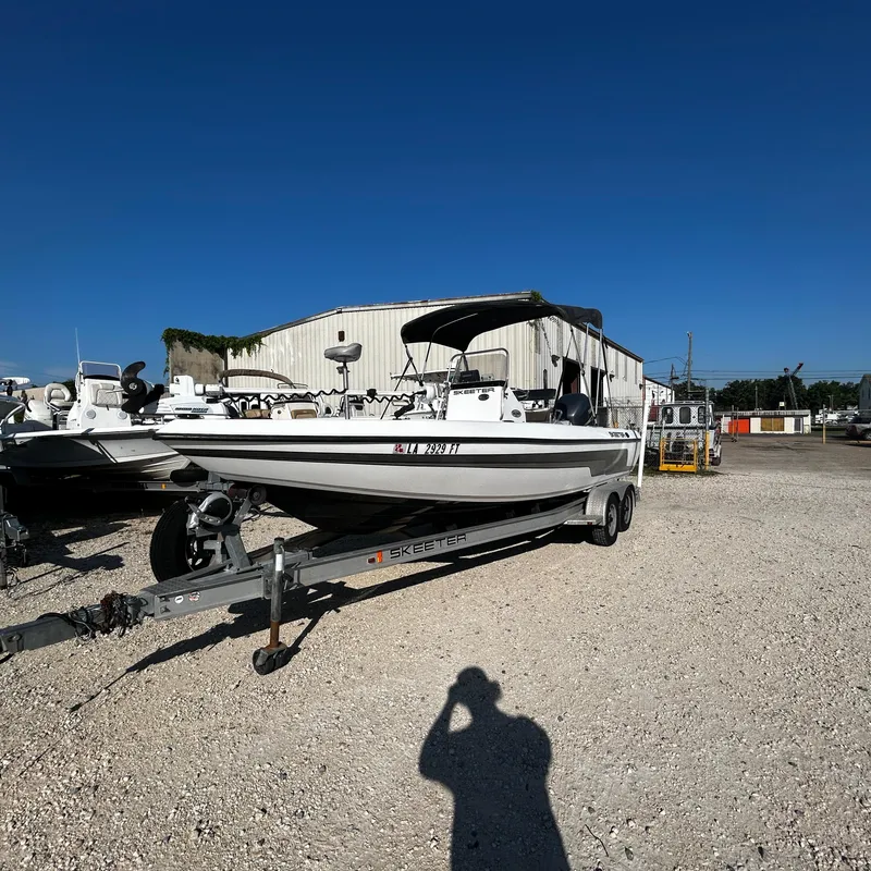 Slide: The Image of 2008 Skeeter ZX2250 boat on trailer in a gravel lot. - 8
