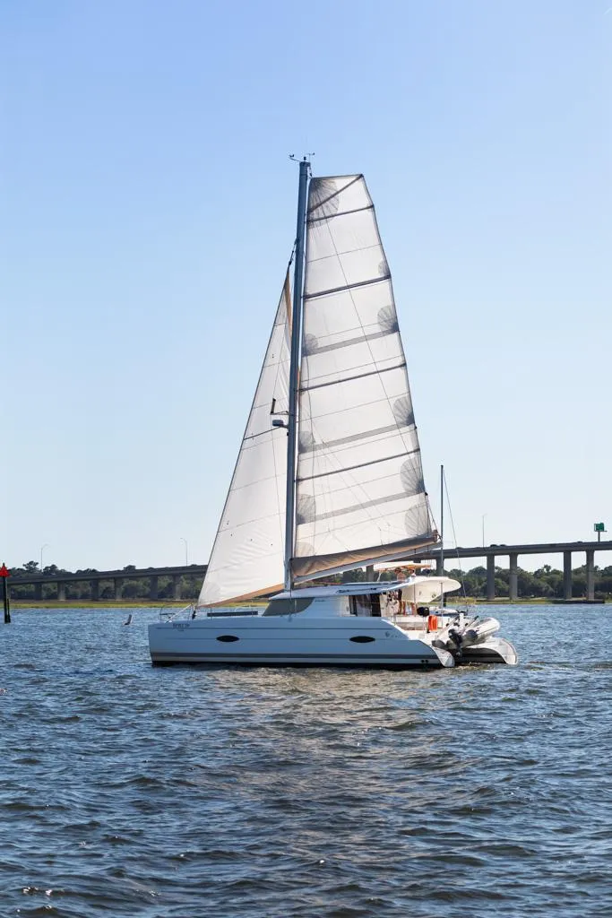 Slide: The Image of 2013 Fountaine Pajot Lipari 41 catamaran sailing on calm waters. - 11