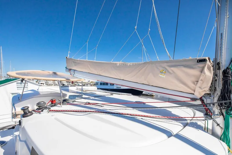 Slide: The Image of 2013 Fountaine Pajot Lipari 41 catamaran deck with sail cover and rigging. - 25