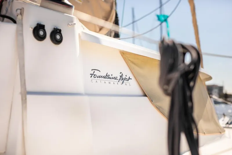 Slide: The Image of Close-up of 2013 Fountaine Pajot Lipari 41 catamaran with logo and rigging. - 26