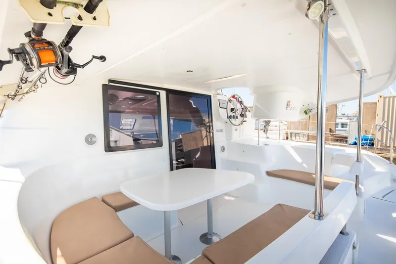 Slide: The Image of Spacious 2013 Fountaine Pajot Lipari 41 catamaran cockpit with seating and table. - 30