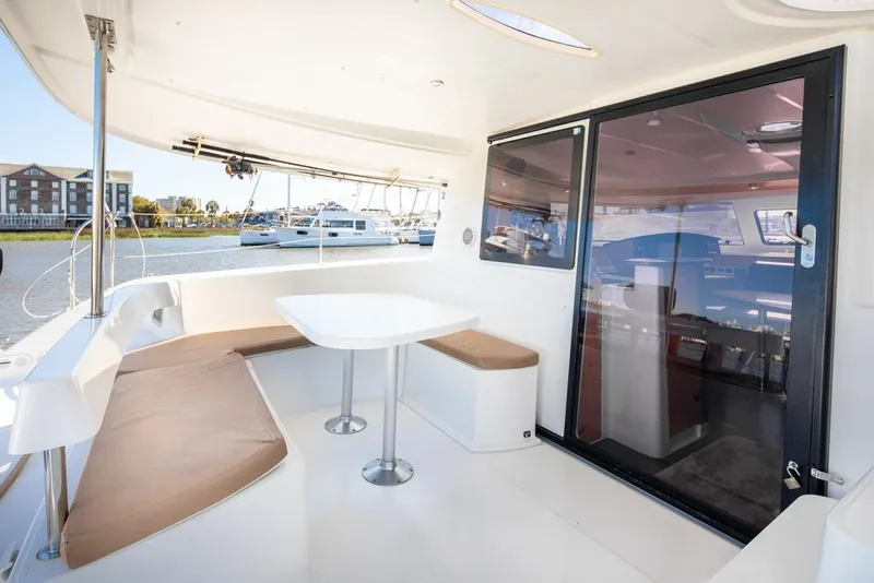 Slide: The Image of 2013 Fountaine Pajot Lipari 41 catamaran with spacious outdoor seating and dining area. - 31