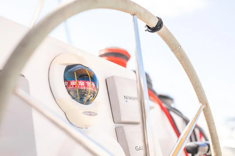 Slide: The Image of Close-up of 2013 Fountaine Pajot Lipari 41 yacht helm with compass and navigation controls. - 37