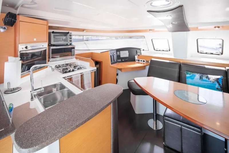 Slide: The Image of Modern interior of 2013 Fountaine Pajot Lipari 41 catamaran with kitchen and seating area. - 41