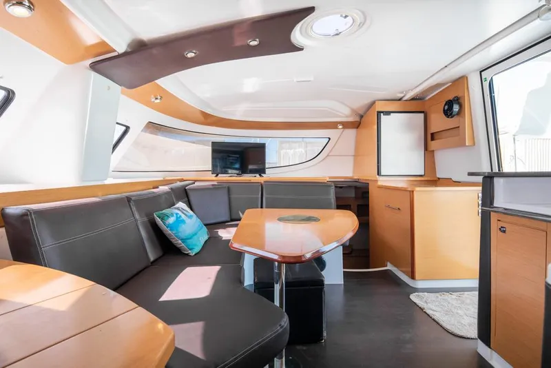 Slide: The Image of Interior of 2013 Fountaine Pajot Lipari 41 catamaran with modern seating and dining area. - 46