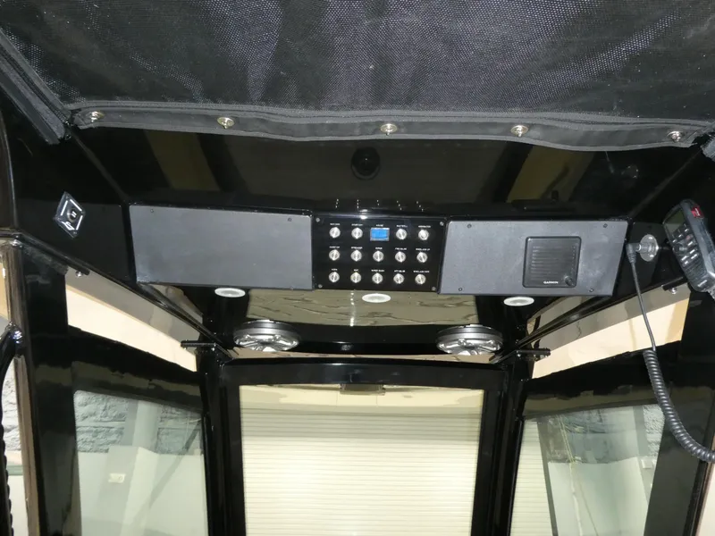 Slide: The Image of 2024 Scout 305 LXF boat control panel and electronics. - 17