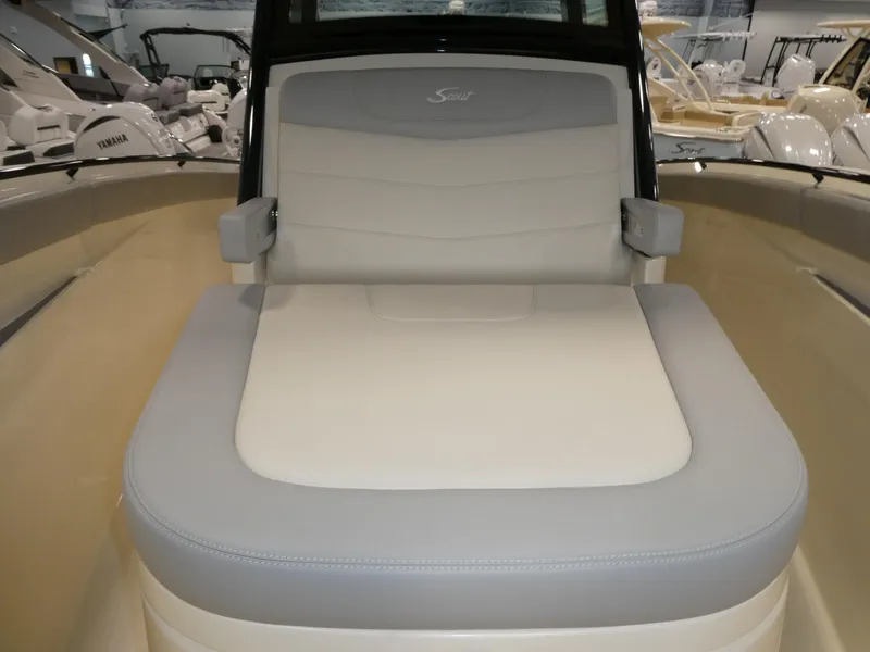 Slide: The Image of 2024 Scout 305 LXF boat interior with cushioned seating. - 20