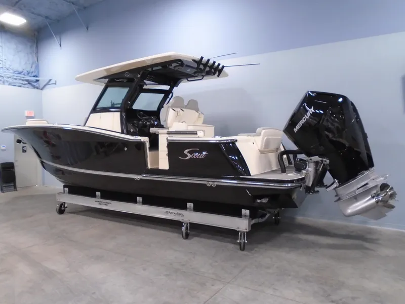 Slide: The Image of 2024 Scout 305 LXF boat with Mercury outboard engine in showroom. - 3