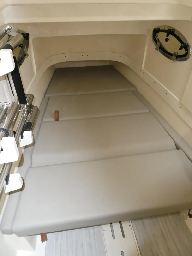 Slide: The Image of 2024 Scout 305 LXF cabin interior with cushioned seating. - 47