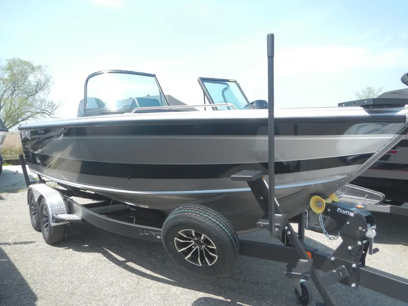 Slide: The Image of 2024 Lund 2075 Tyee boat on a trailer, side view. - 0