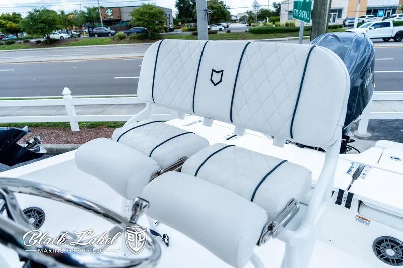 Slide: The Image of 2024 Sea Fox 231 Bay Fox Center Console boat seating with quilted white upholstery. - 14