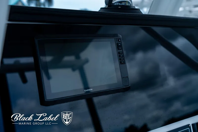 Slide: The Image of 2024 Sea Fox 231 Bay Fox Center Console dashboard with Garmin display. - 16