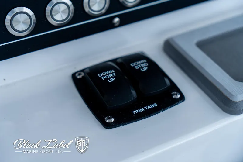 Slide: The Image of 2024 Sea Fox 231 Bay Fox Center Console trim tab controls on dashboard. - 20