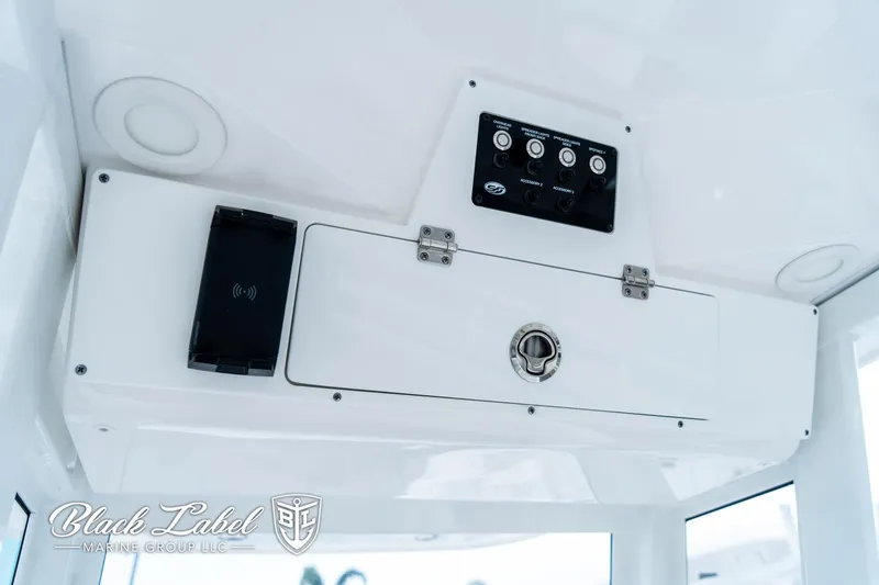 Slide: The Image of 2024 Sea Fox 231 Bay Fox Center Console dashboard with control panel and storage compartment. - 25