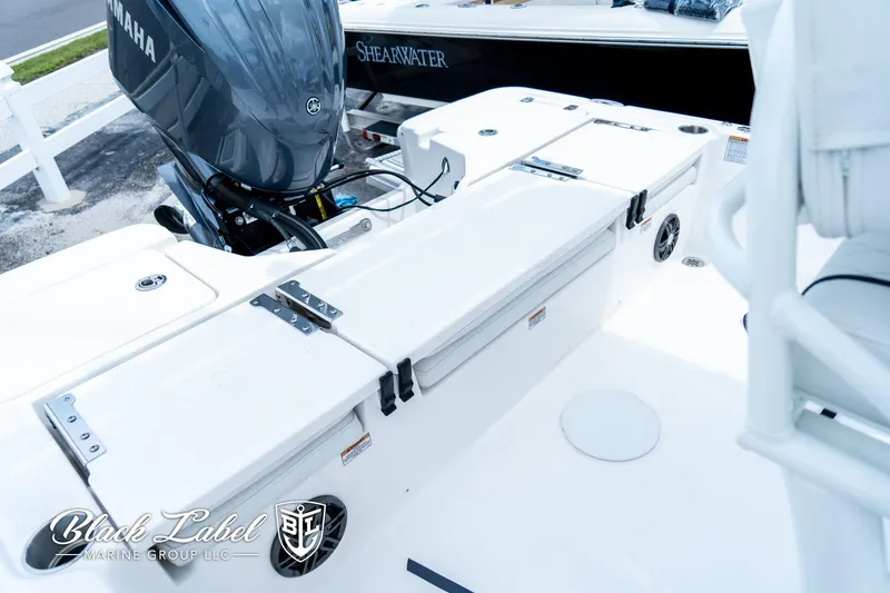 Slide: The Image of 2024 Sea Fox 231 Bay Fox Center Console boat with Yamaha engine, featuring spacious deck layout. - 27