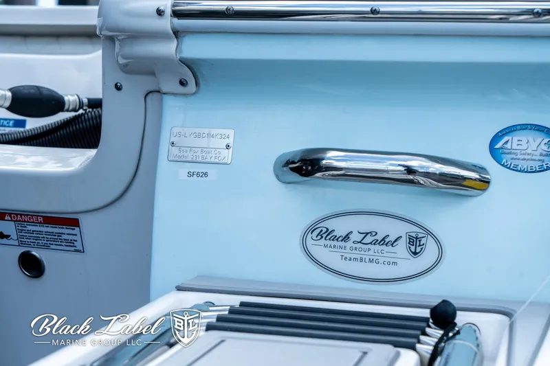 Slide: The Image of 2024 Sea Fox 231 Bay Fox Center Console interior with Black Label Marine Group logo. - 5
