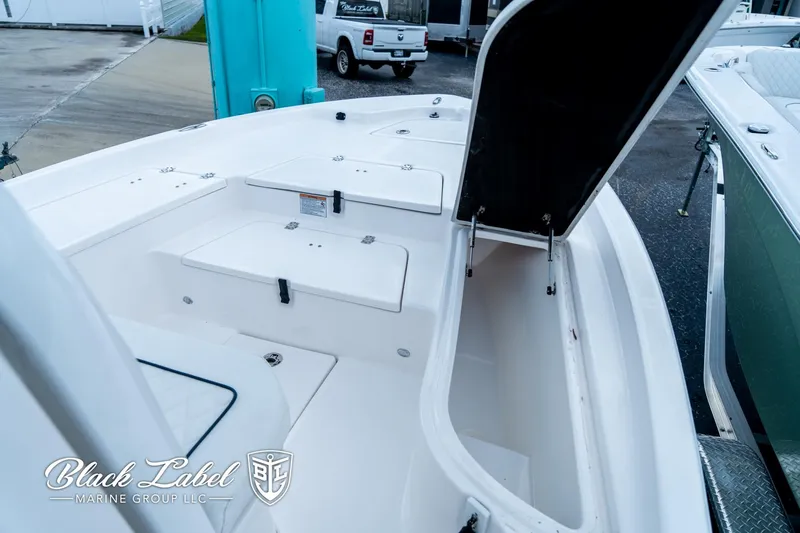 Slide: The Image of 2024 Sea Fox 231 Bay Fox Center Console boat with open storage compartment. - 8