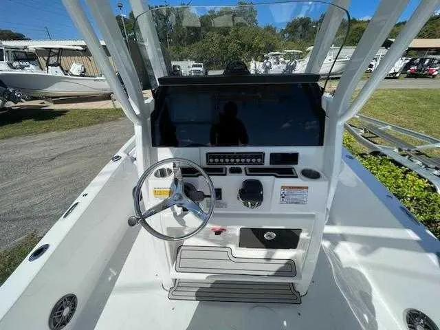 Slide: The Image of 2024 Sea Fox 231 Bay Fox Center Console boat dashboard and steering wheel. - 10