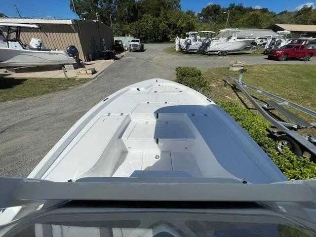 Slide: The Image of 2024 Sea Fox 231 Bay Fox Center Console boat on display at a dealership. - 11