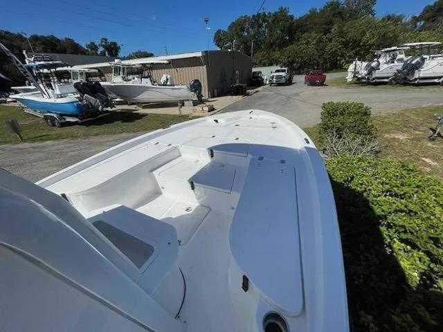 Slide: The Image of 2024 Sea Fox 231 Bay Fox Center Console boat at a marina. - 12