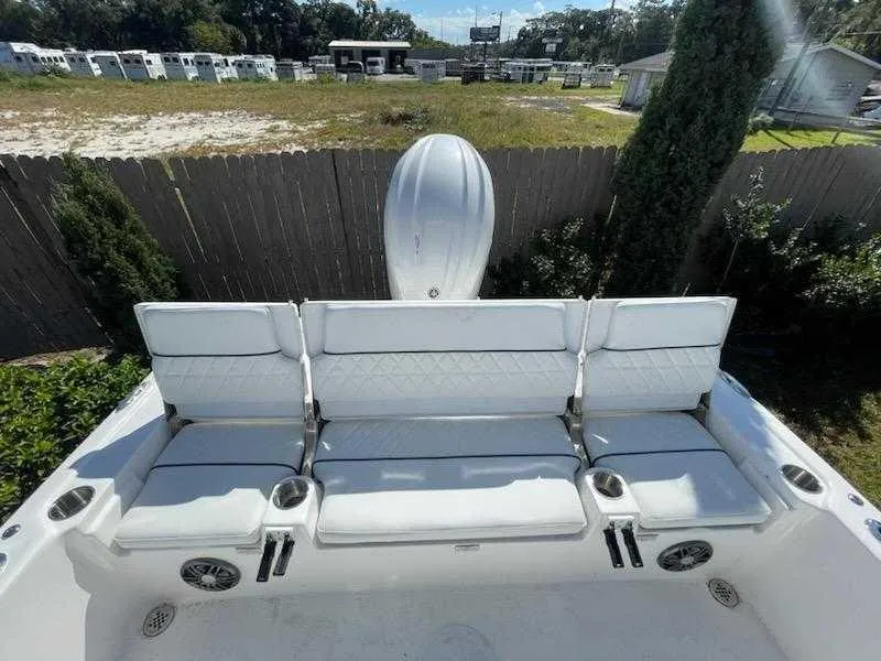 Slide: The Image of 2024 Sea Fox 231 Bay Fox Center Console boat with white cushioned seating. - 15