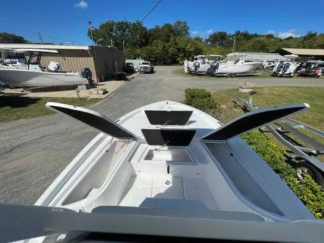 Slide: The Image of 2024 Sea Fox 231 Bay Fox Center Console boat with open storage compartments. - 17
