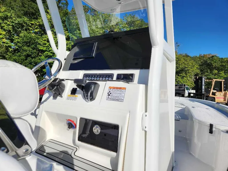 Slide: The Image of 2024 Sea Fox 231 Bay Fox Center Console boat dashboard and controls. - 2