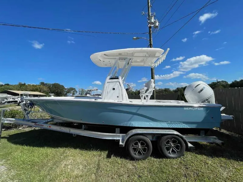 Slide: The Image of 2024 Sea Fox 231 Bay Fox Center Console boat on trailer, side view. - 5