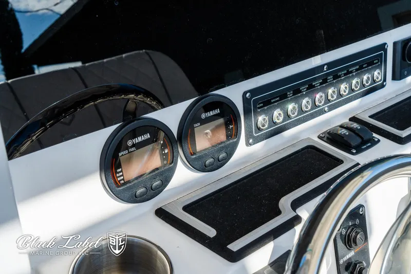 Slide: The Image of 2024 Sea Fox 231 Bay Fox Center Console dashboard with Yamaha gauges and controls. - 16