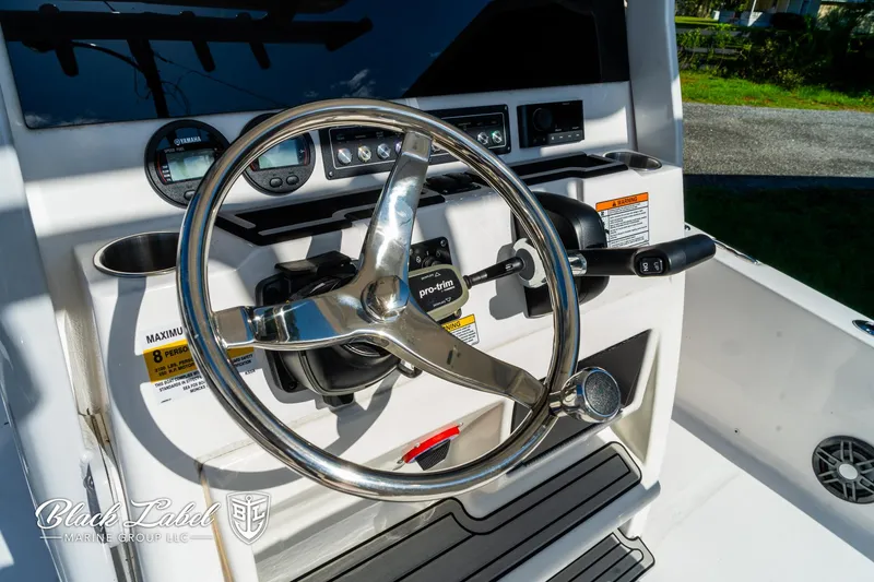 Slide: The Image of 2024 Sea Fox 231 Bay Fox Center Console steering wheel and dashboard controls. - 18