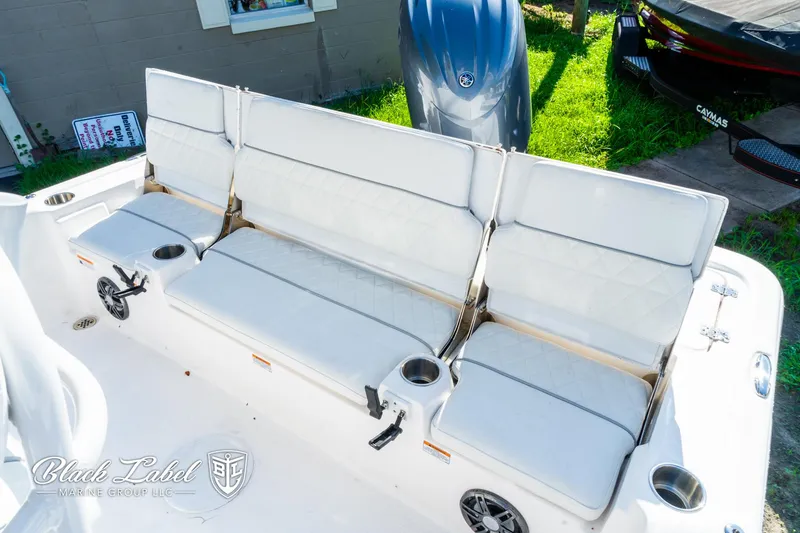 Slide: The Image of 2024 Sea Fox 231 Bay Fox Center Console boat seating area with cup holders. - 22