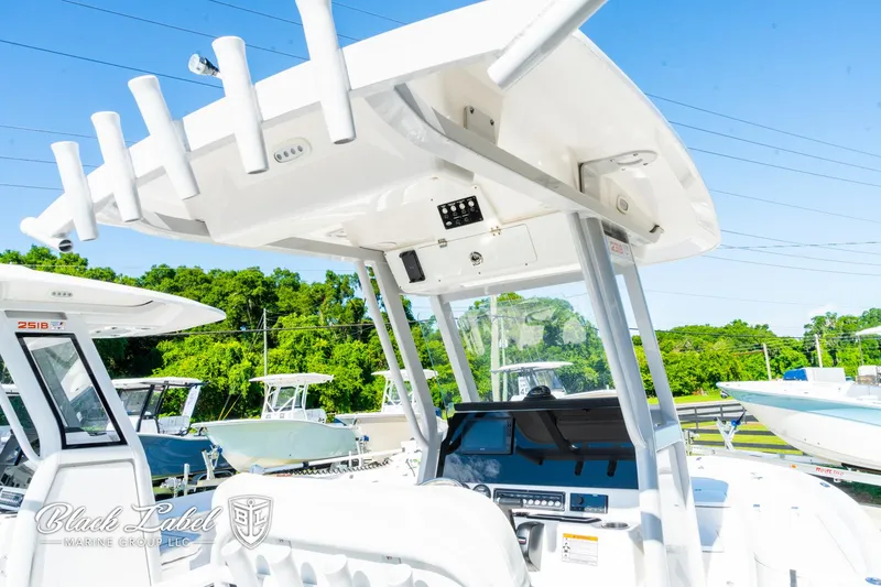 Slide: The Image of 2024 Sea Fox 231 Bay Fox Center Console boat with modern helm and canopy. - 25