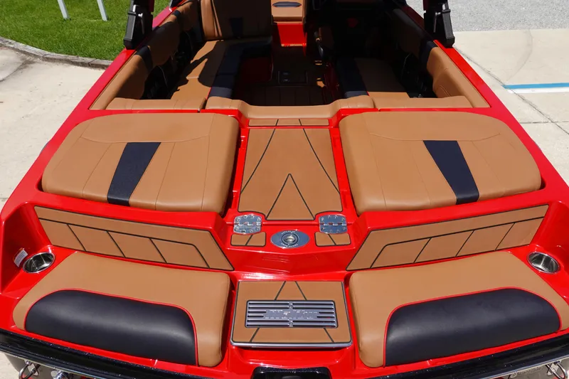 Slide: The Image of 2023 Malibu 23 LSV boat interior with red and tan upholstery. - 13
