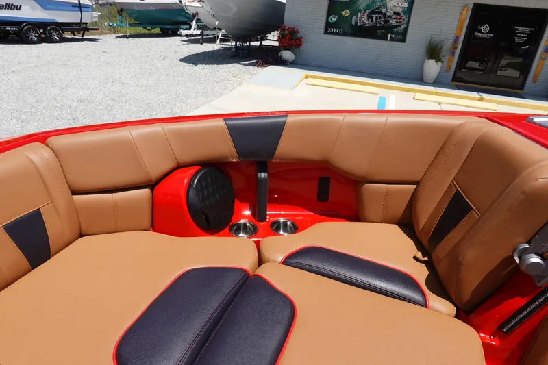 Slide: The Image of 2023 Malibu 23 LSV boat interior with tan and black seating. - 17