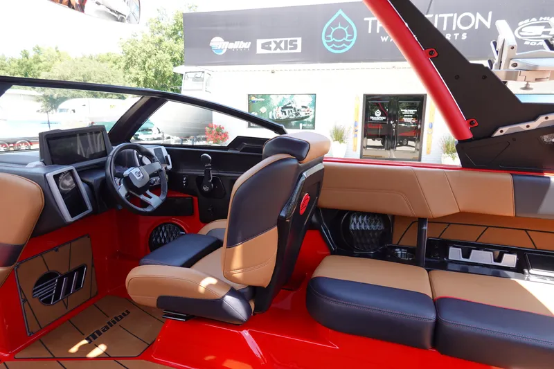 Slide: The Image of 2023 Malibu 23 LSV boat interior with red and tan leather seats. - 18