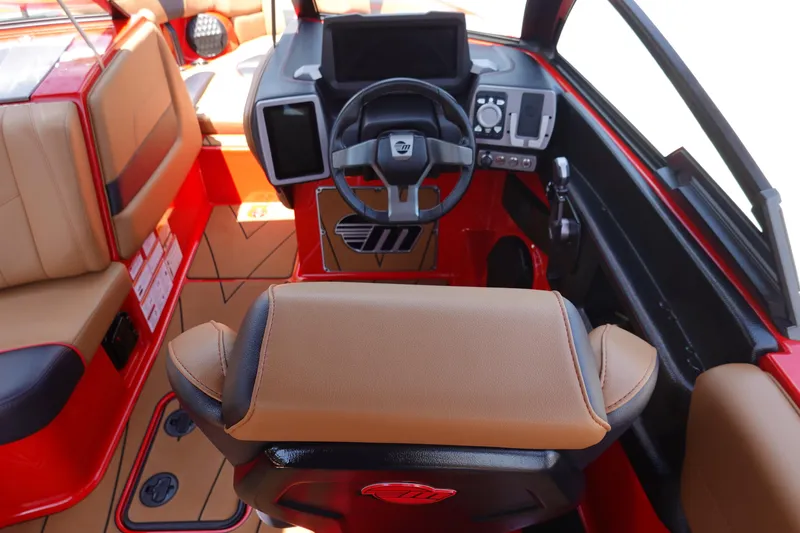 Slide: The Image of 2023 Malibu 23 LSV boat interior with steering wheel and dashboard. - 19