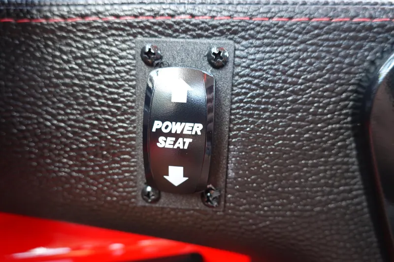 Slide: The Image of Power seat control switch in 2023 Malibu 23 LSV boat interior. - 26